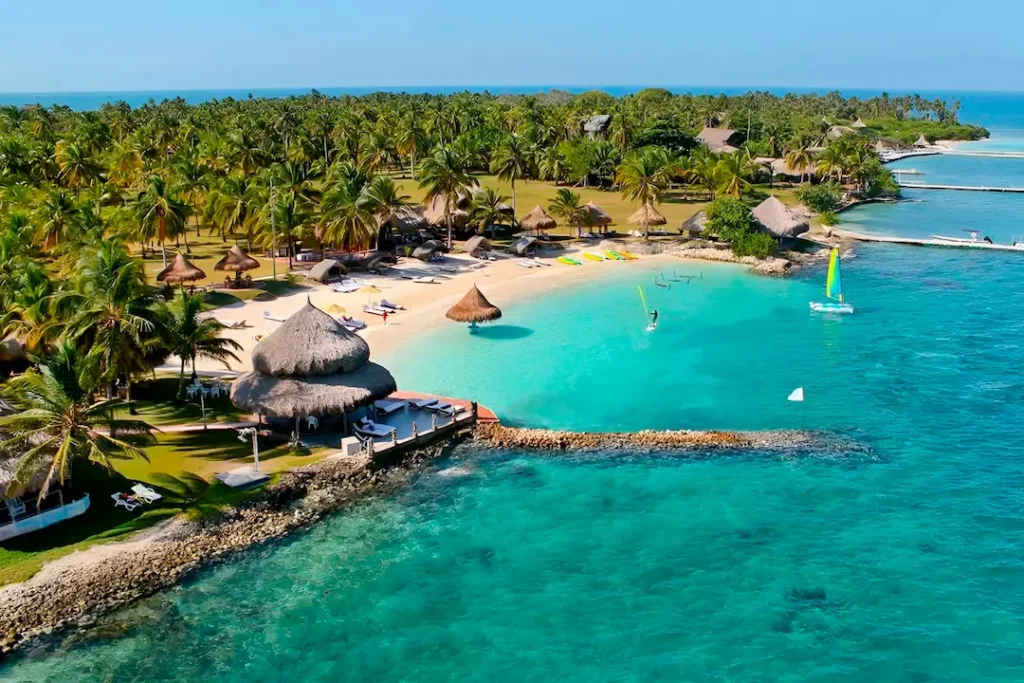 Aerial view of turquoise Caribbean beach with palm trees at Rincón del Mar, Colombia