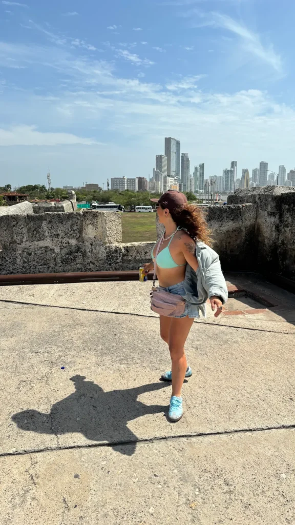 Traveler walking on the historic city walls of Cartagena with skyline view, Colombia